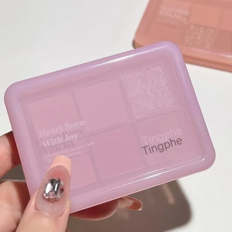 Palette de fards à paupières rose clair à paillettes